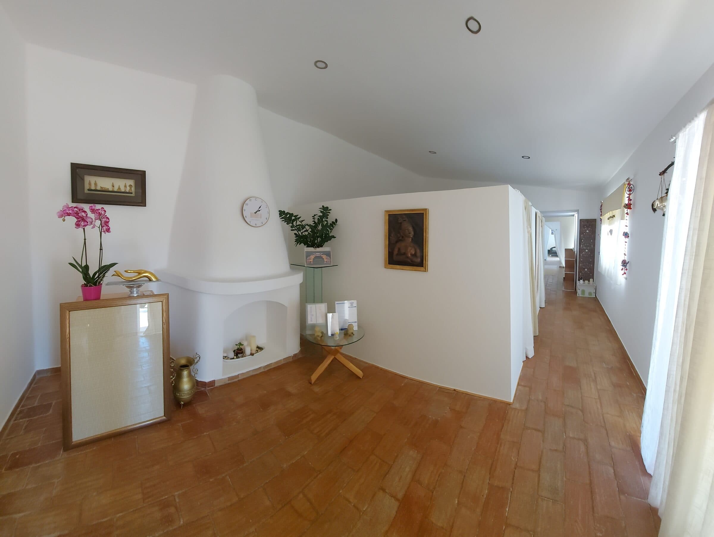 The reception area, with orchids and framed Buddha artwork