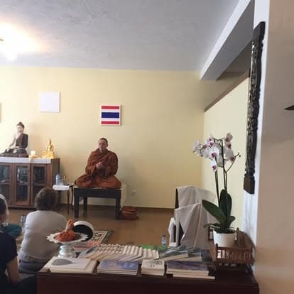 Monks leading the blessing ceremony at the altar