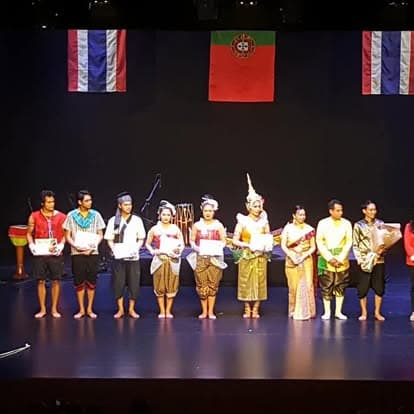 Full ensemble on stage at a regional festival
